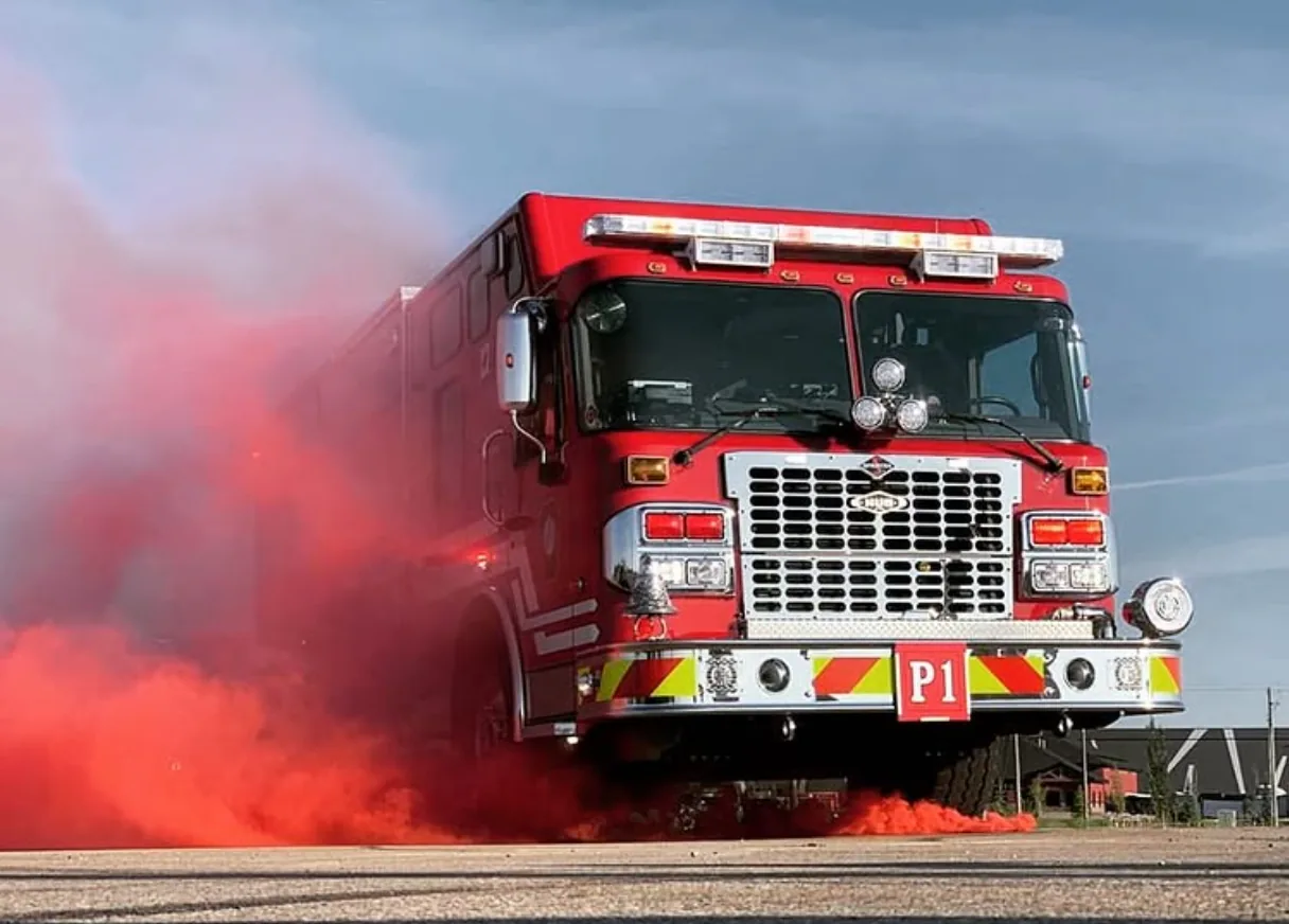 Engine releasing red smoke during a ceremony